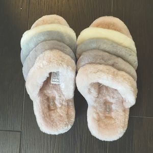 UGG fluffy slippers. Pink with pink, purple, grey and white across top size 6